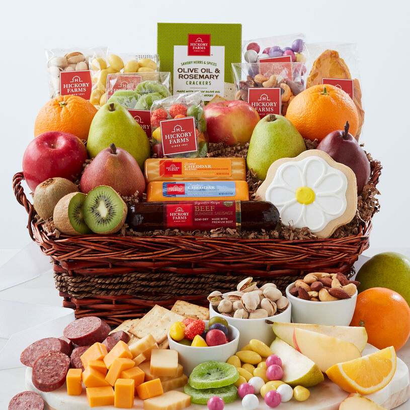 Bountiful Spring Gift Basket includes summer sausage, cheese, fruit, nuts, crackers, and a flower cookie