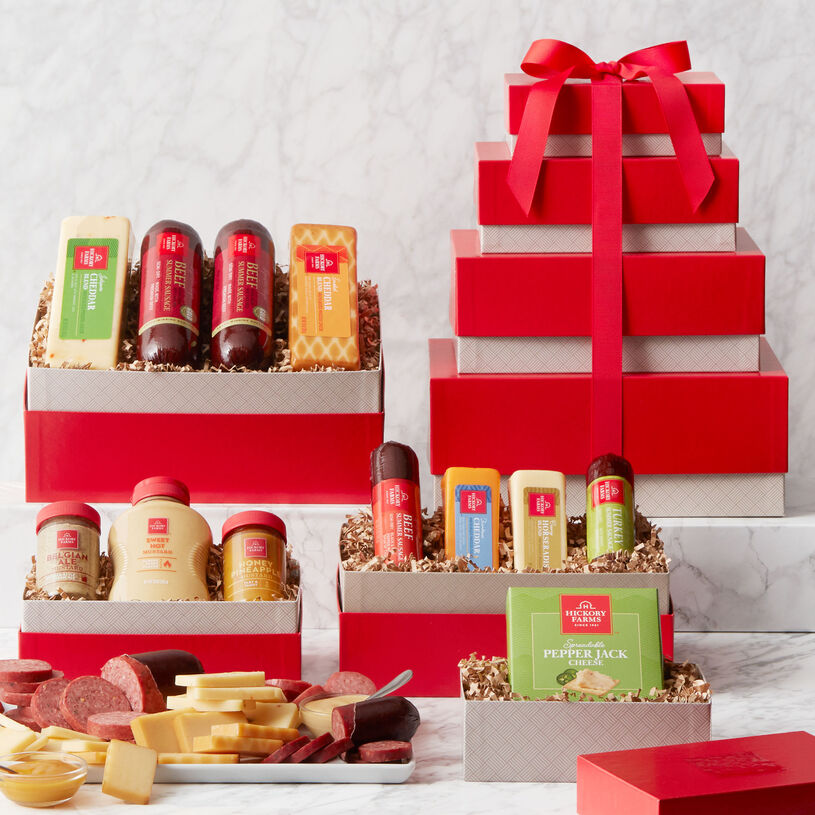 This savory gift starts with an assortment of Hickory Farms classics, Signature Beef Summer Sausage and cheeses. Next is a box of bold flavors like Turkey and Spicy Summer Sausages, Horseradish Cheese, and Farmhouse Cheddar, and spreadable cheese.