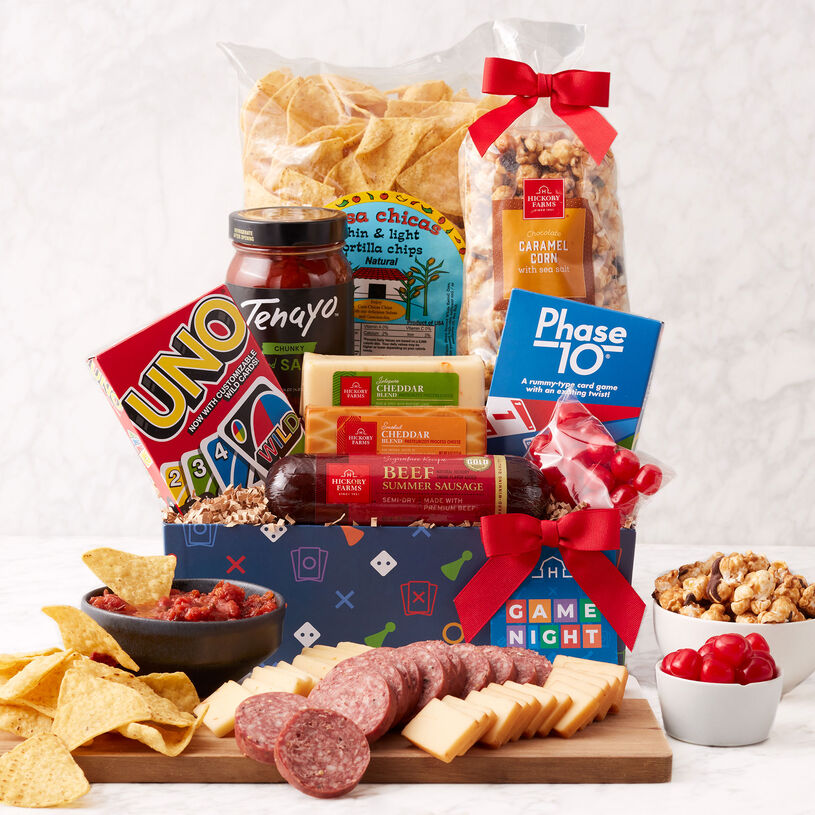 Gift set filled with snacks like summer sausage, cheese, tortilla chips, salsa, chocolate caramel corn, and Cherry Sours. Plus, UNO and Phase 10 games.