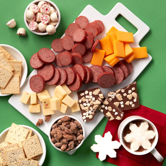 Happ Holidays Gift Basket meat and cheese sliced and arranged on board