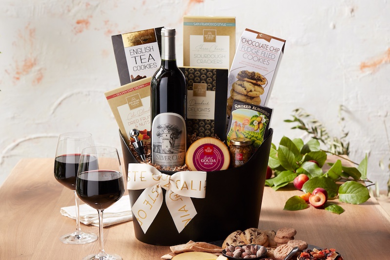 Image of woman selecting a bottle of wine from a shelf in a market or store