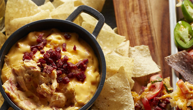 Queso with summer sausage and cheddar cheese