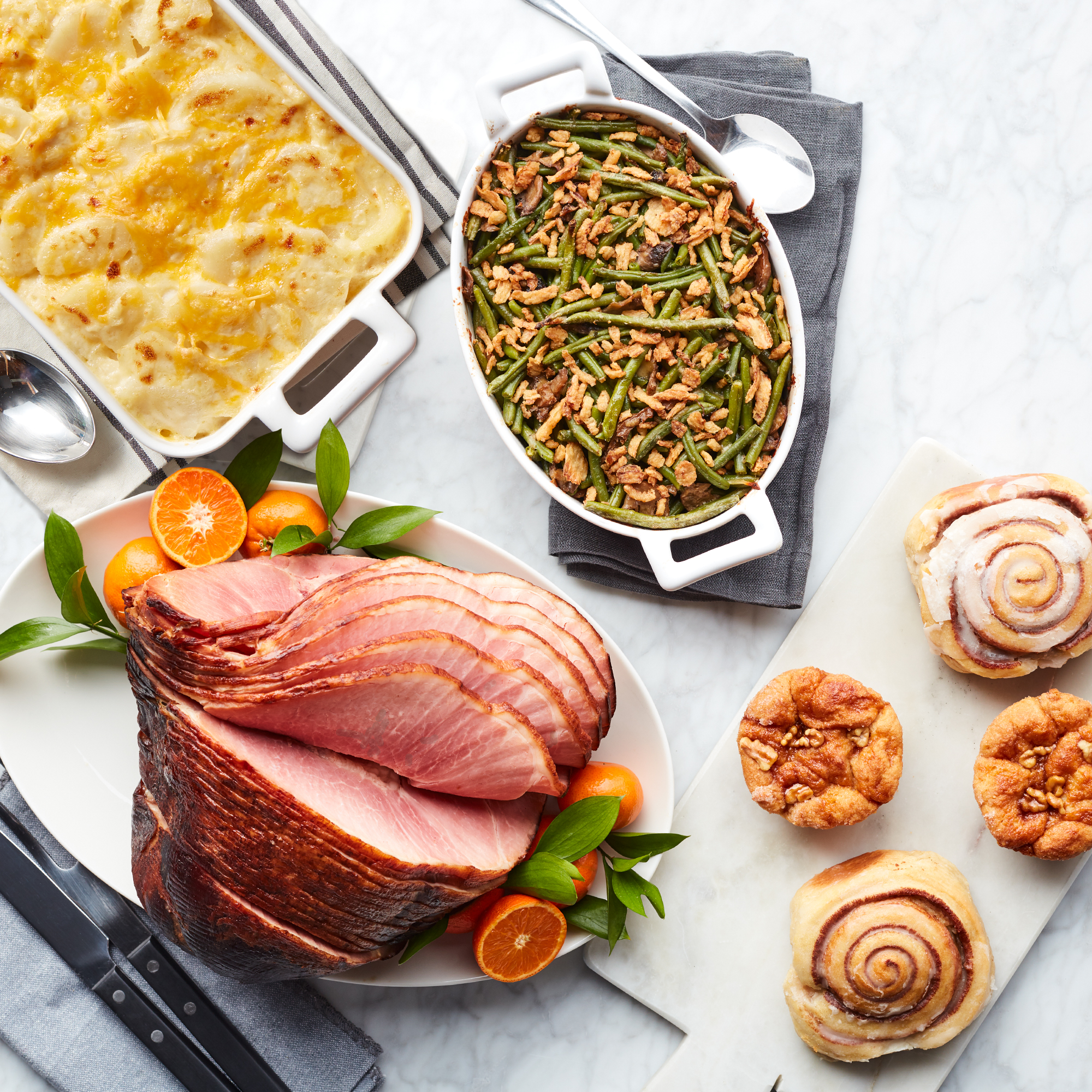 This meal includes HoneyGold Spiral Sliced Ham, Scalloped Potatoes, Green Bean Casserole, Cinnamon Buns & Cinnamon Pull-Apart Rolls.