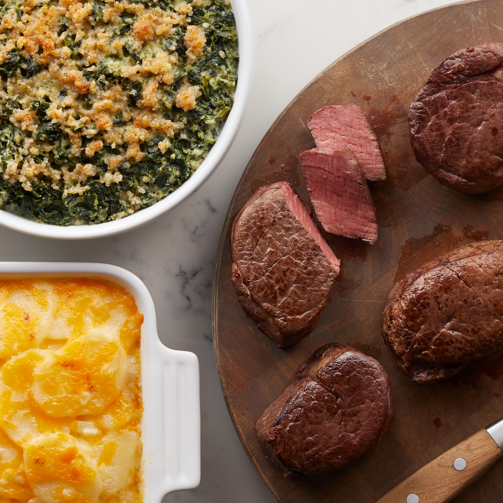A gourmet dinner to impress with four 6 oz Filet Mignon, Green Bean Casserole, and Three Cheese Scalloped Potatoes.