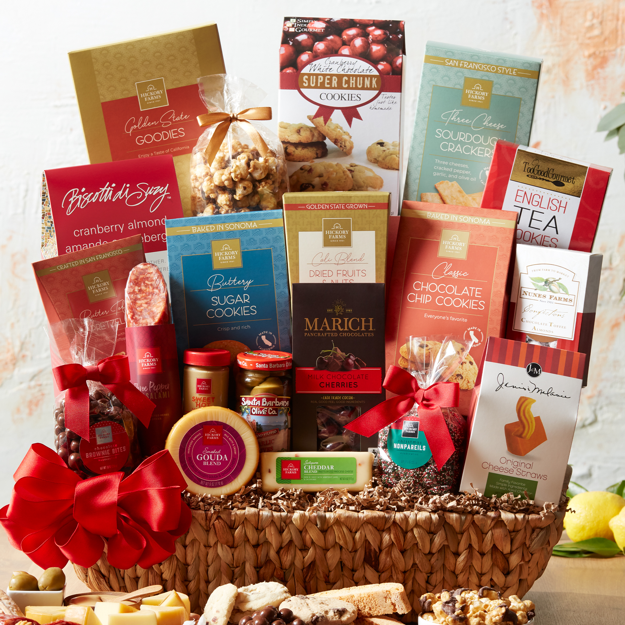 This California Holiday Gift Basket is filled with a variety of cheeses, mustard, crackers, olives, chocolate, cookies and candies.