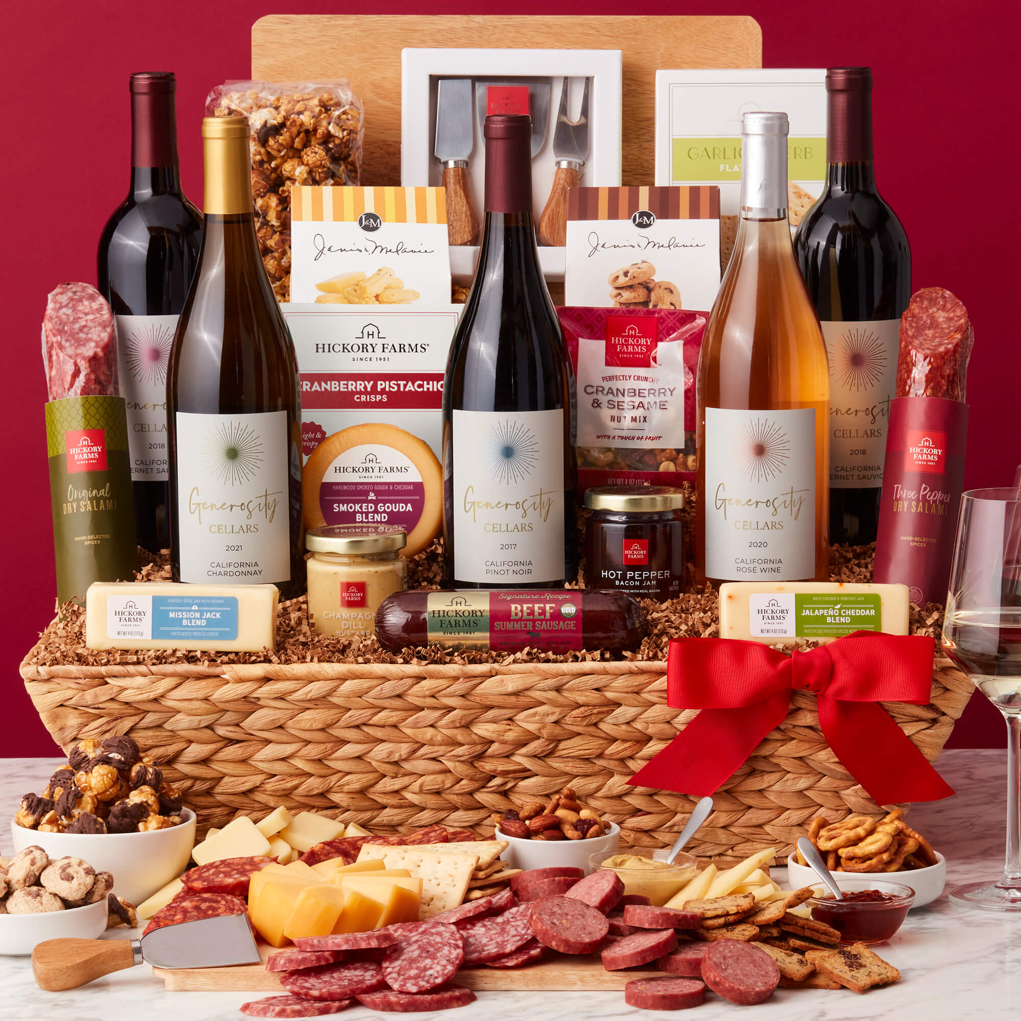 Ultimate Gathering Wine Gift Basket includes beef sausage, salami, cheese, mustard, crackers, pretzels, sweets, and wine
