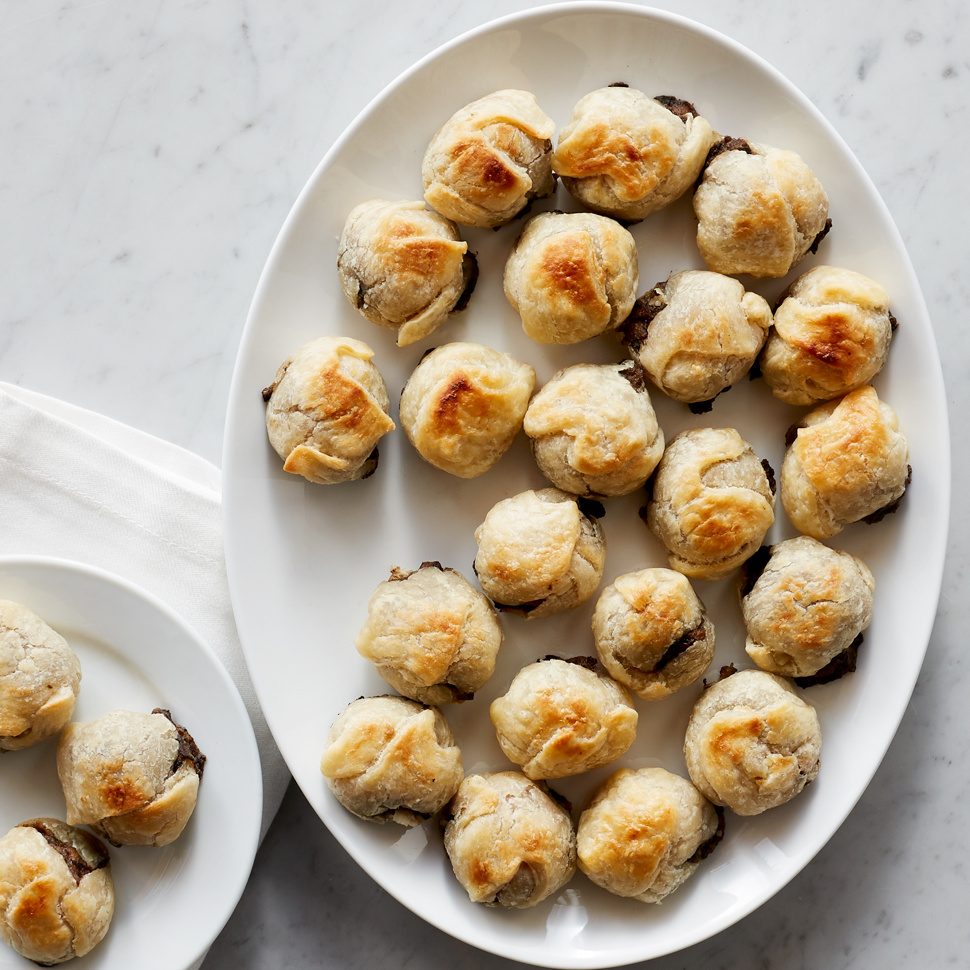 The finest selection of Filet Mignon is enveloped in savory mushrooms and onion before being wrapped in a buttery pastry dough.