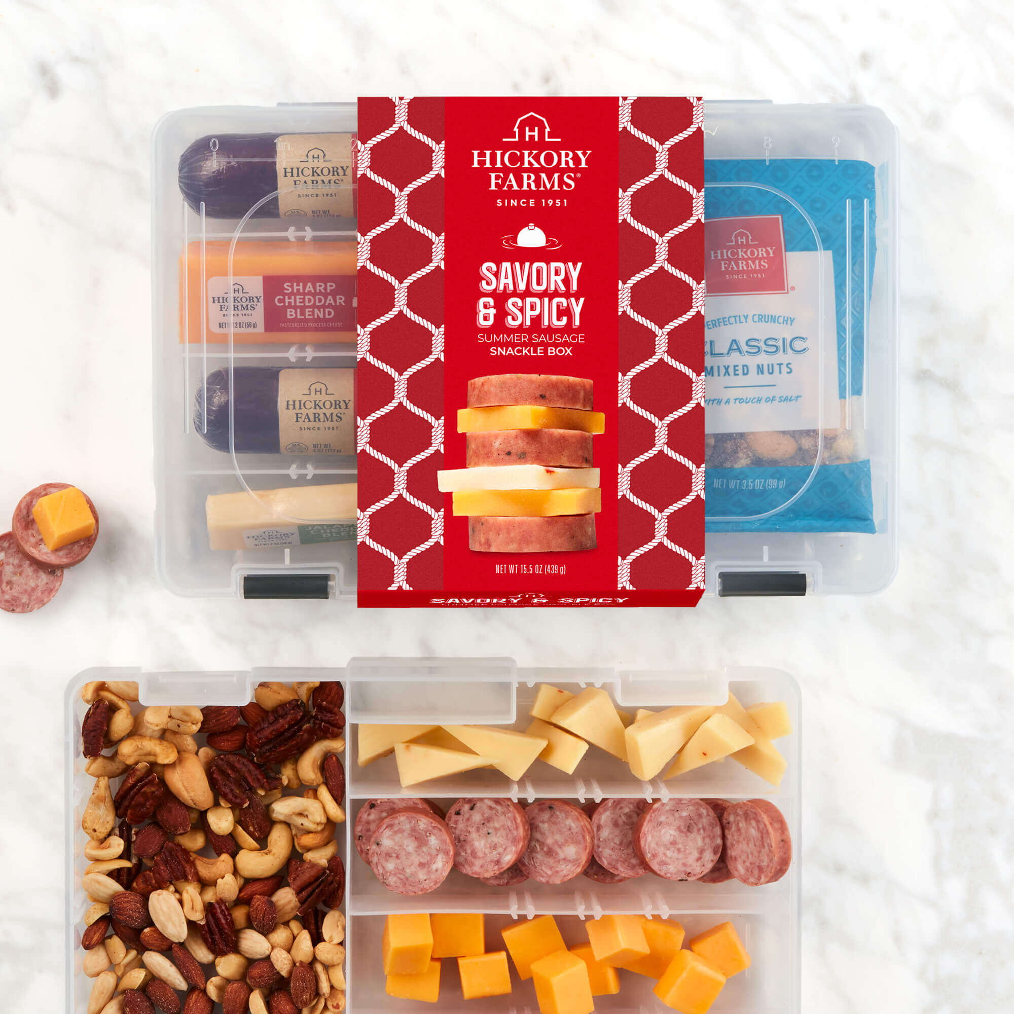 The Hickory Farms Savory and Spicy Summer Sausage Snackle box includes farmhouse and spicy beef sausages, sharp and jalapeno cheeses, and mixed nuts.