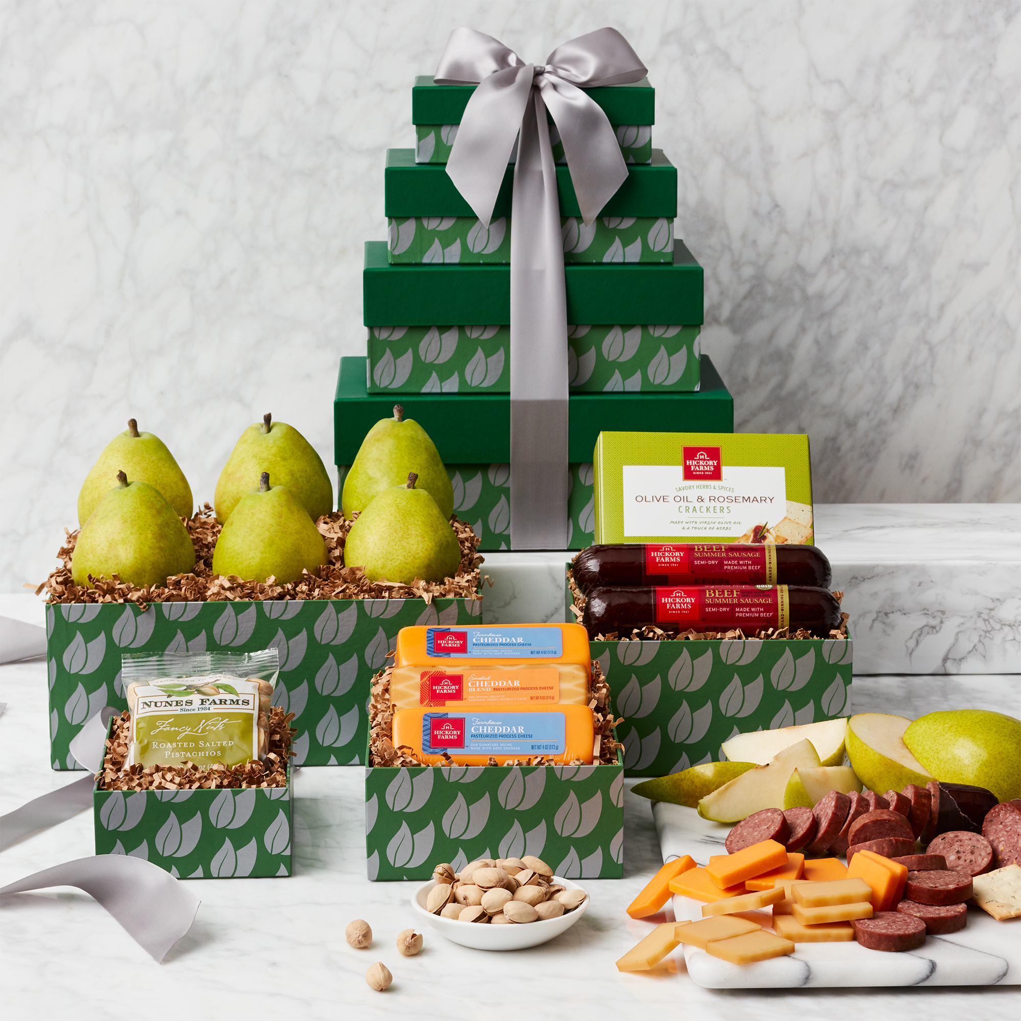 Fruit and Snack Gift Tower includes sausage, cheese, crackers, mixed nuts, and pears