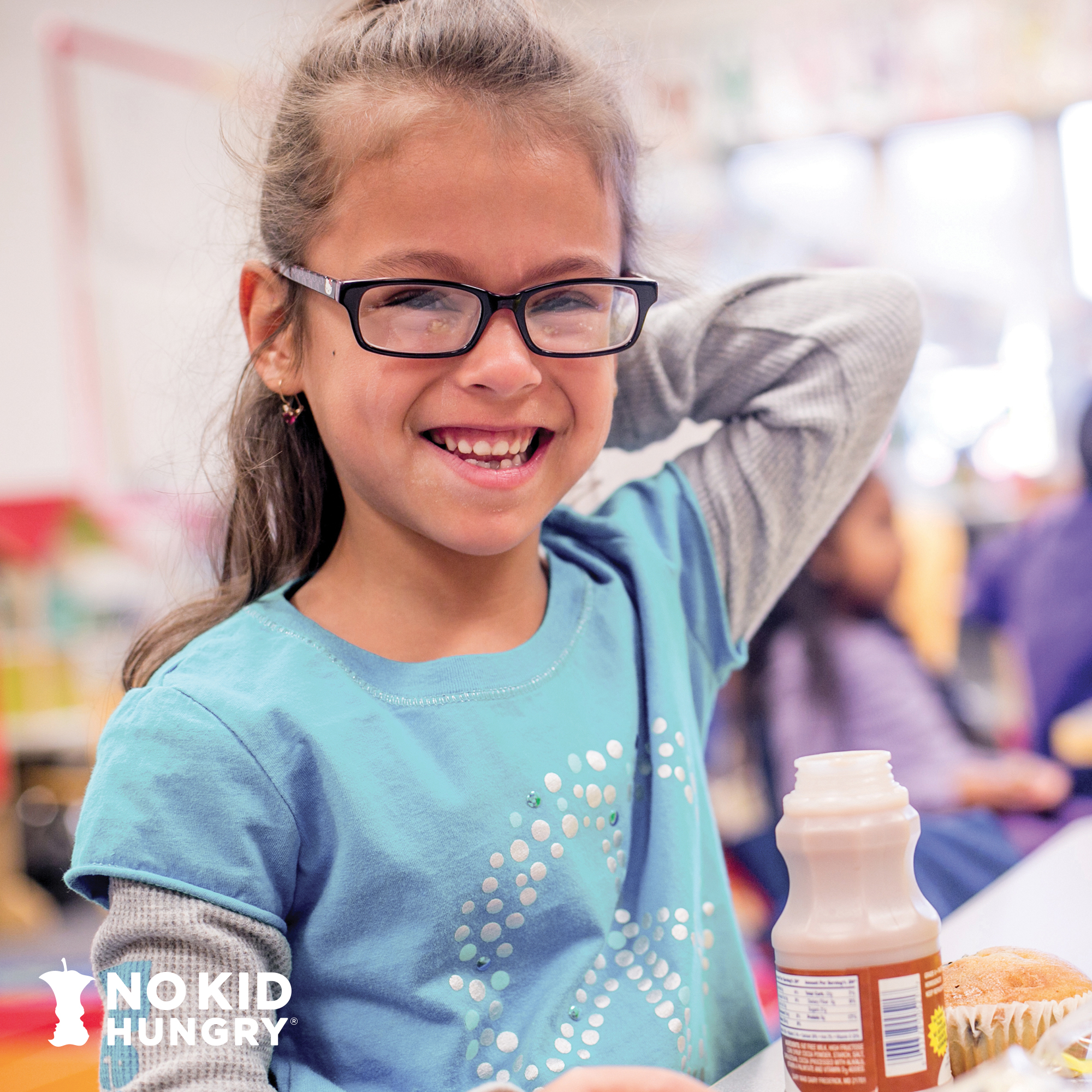 Child eating meal in cafeteria