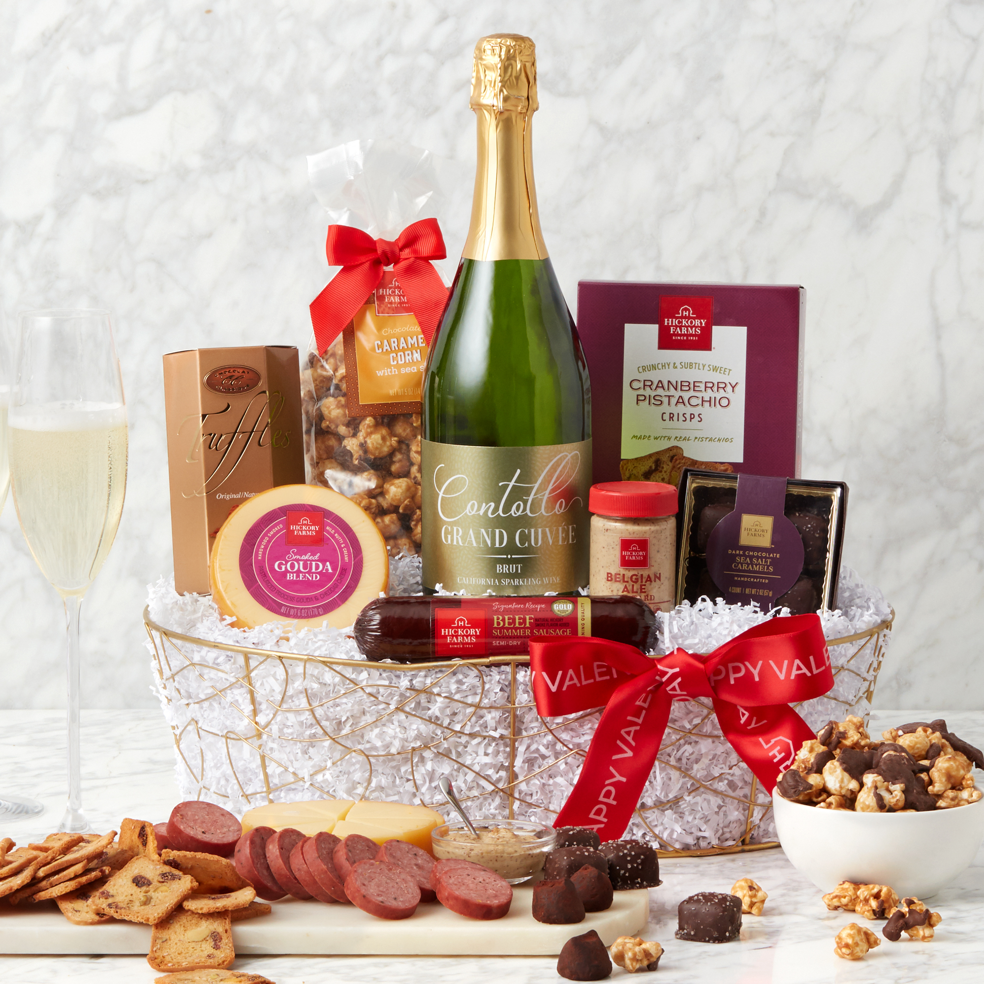 This Valentine's Day gift is filled with beef summer sausage, cheese, mustard, crackers, chocolates, popcorn, and Contollo California Grand Cuv&eacute;e Sparkling Wine.