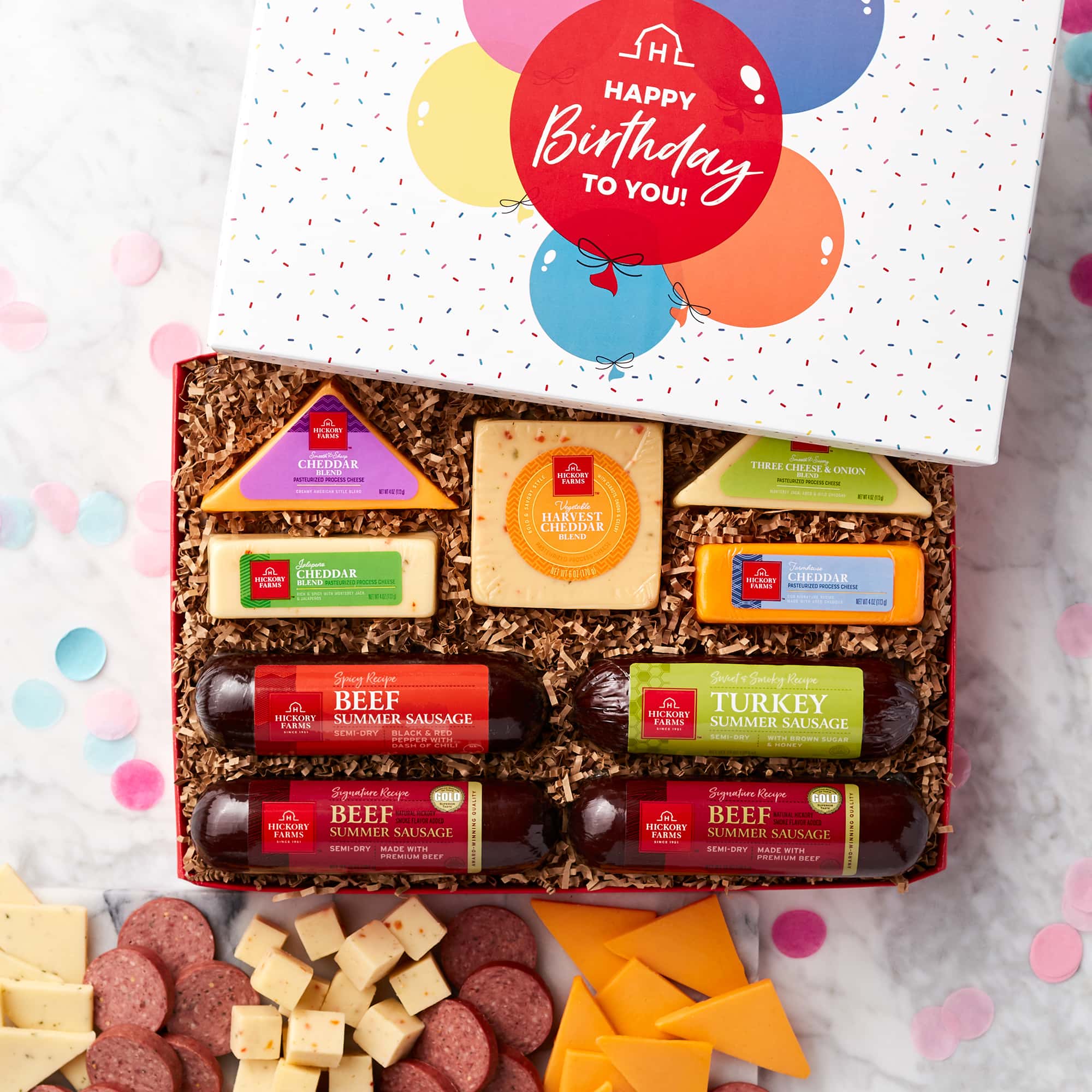 This birthday gift box features Signature Beef, Spicy Beef, and Sweet & Smoky Turkey Summer Sausages and a variety of cheeses.