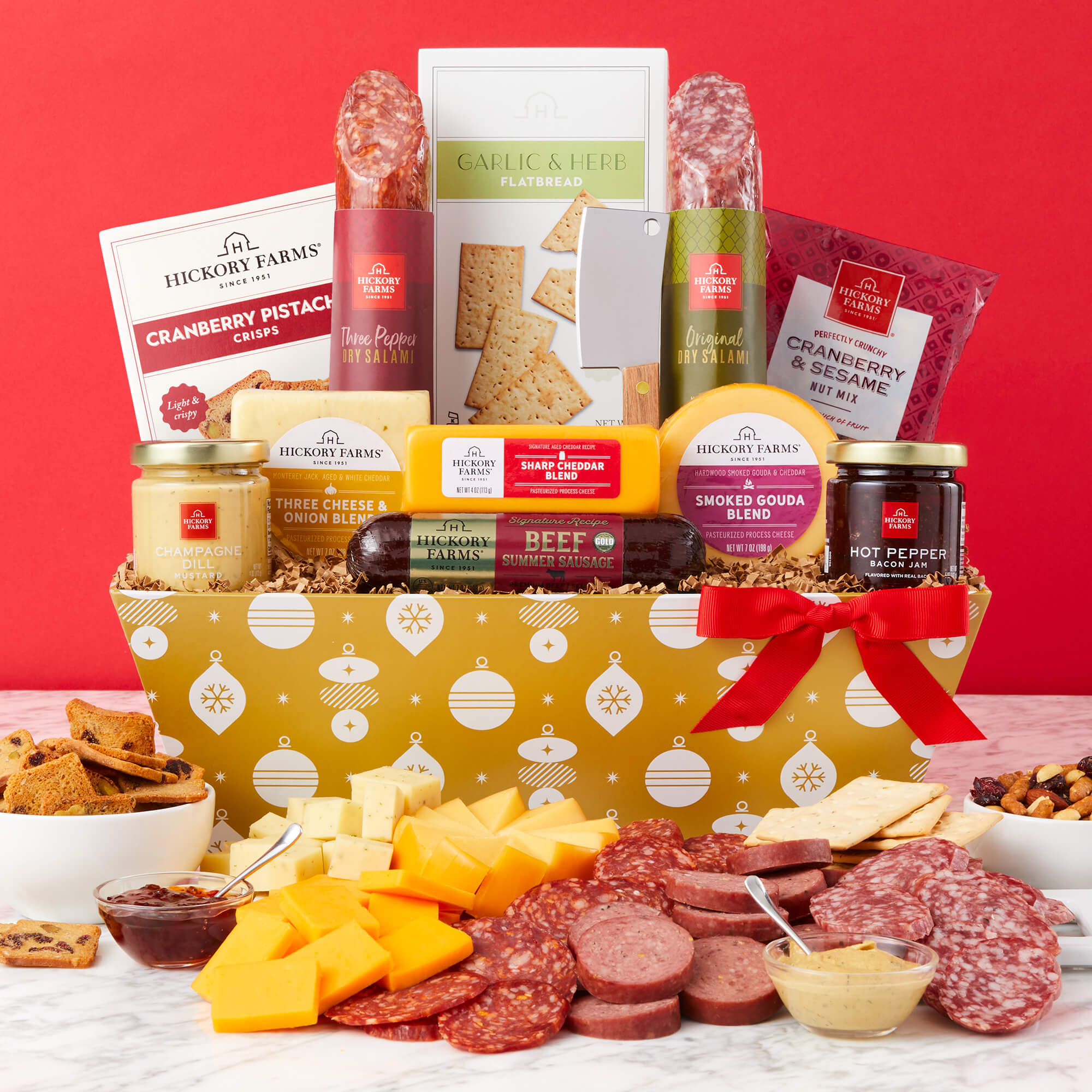 Holiday Charcuterie Gift Basket includes beef sausage, salami, various cheeses, jam, mustard, crackers, and nuts