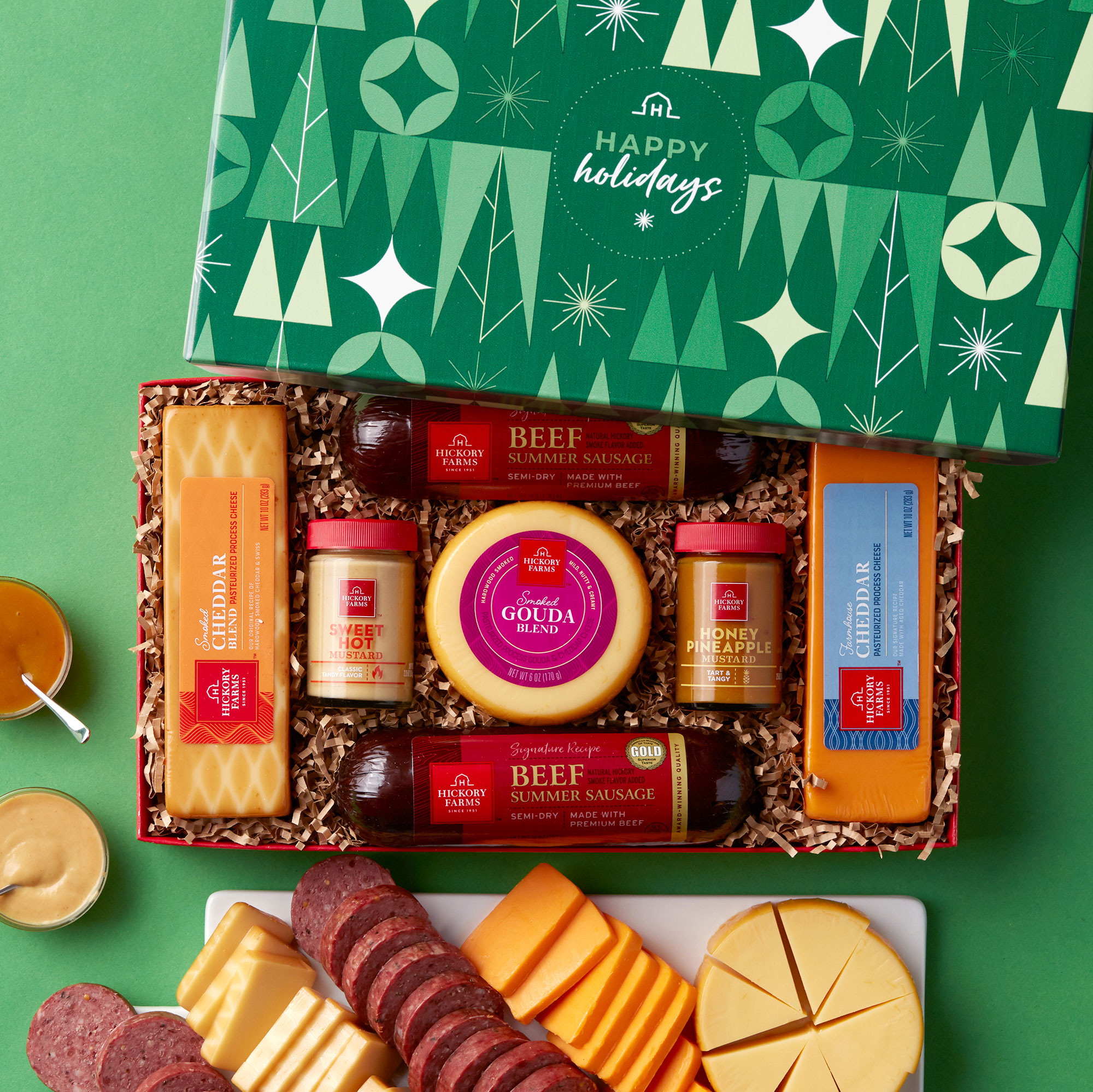 https://www.hickoryfarms.com/on/demandware.static/-/Sites-Web-Master-Catalog/default/dw7ea2b84c/images/products/happy-holidays-summer-sausage-cheese-gift-box-new-006546-1.jpg