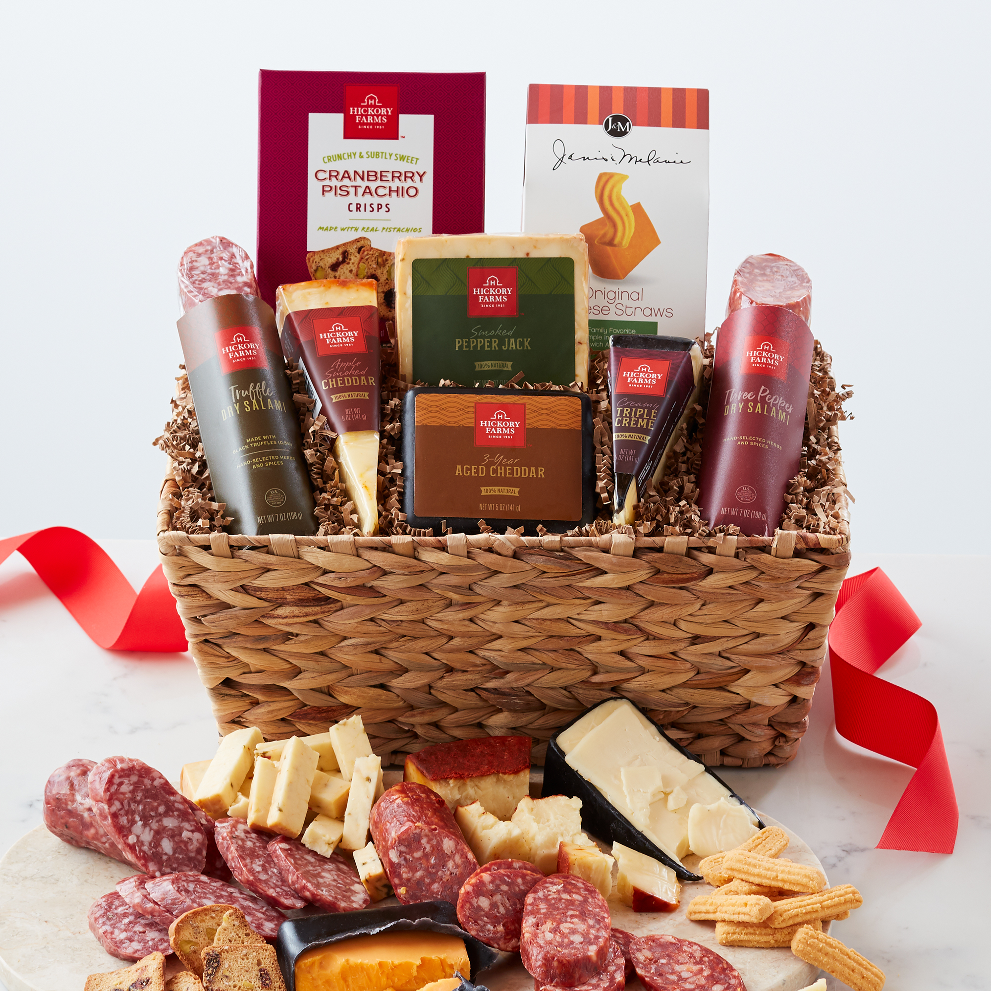 Gift basket includes dry salami, artisan cheeses, and cheese crisps