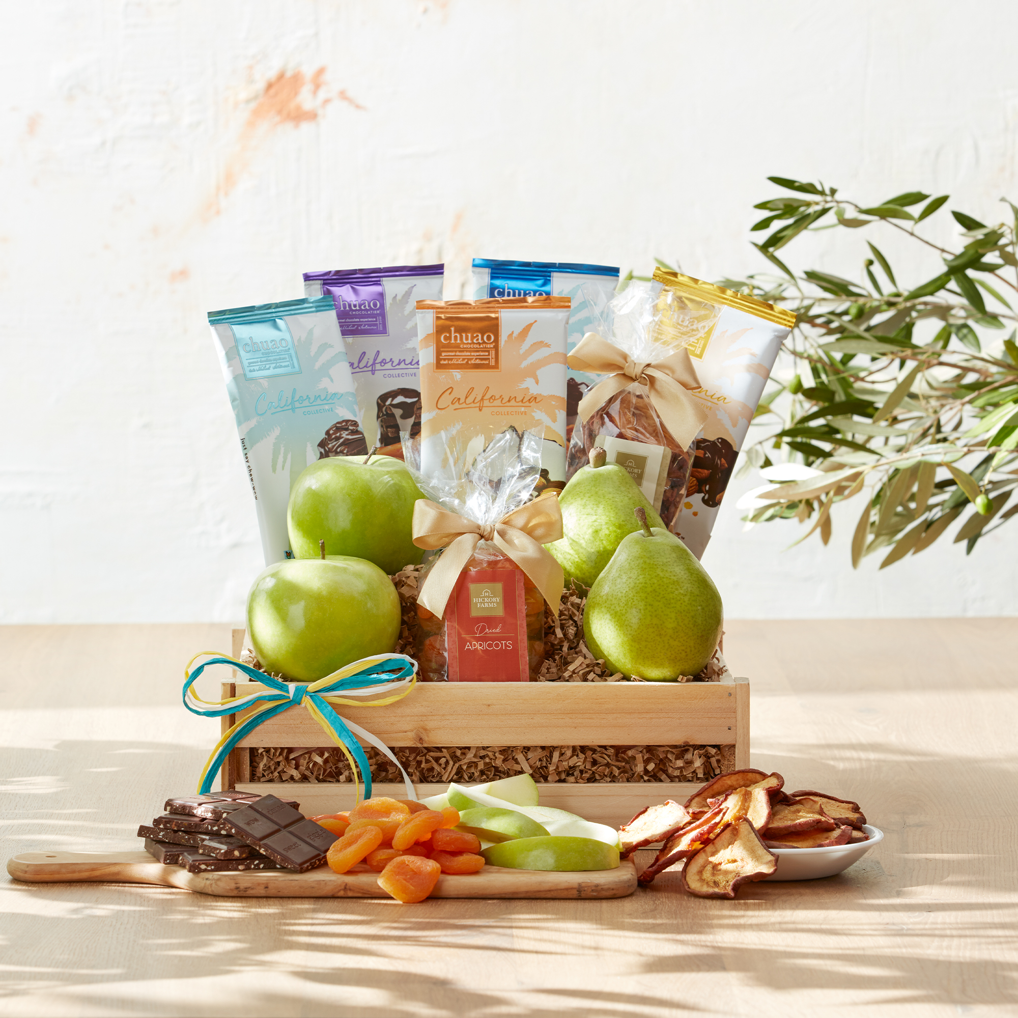 This crate is filled with Comice Pears and green apples, dried fruit, nuts, and five sweet flavors from Southern California's Chuao Chocolatier.