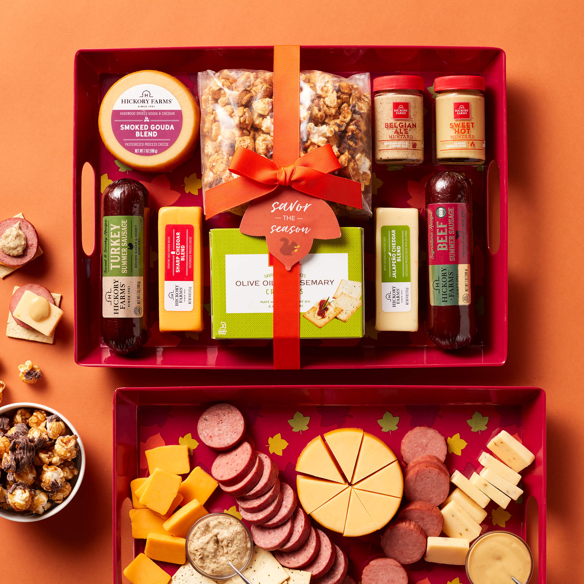 The Autumn Entertaining Gift Set includes beef sausage, turkey sausage, various cheeses and mustards, and popcorn