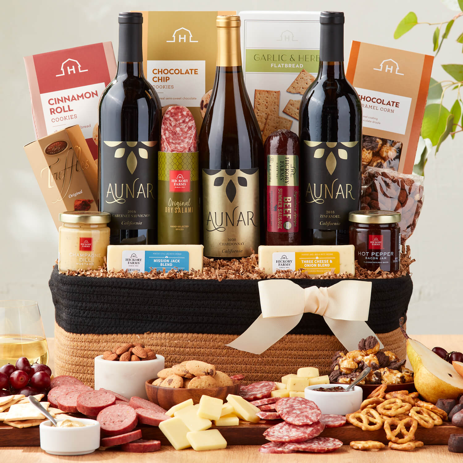Luxe California Wine Gift Basket includes beef sausage, dry salami, various cheeses, crackers, popcorn, almonds, & wine
