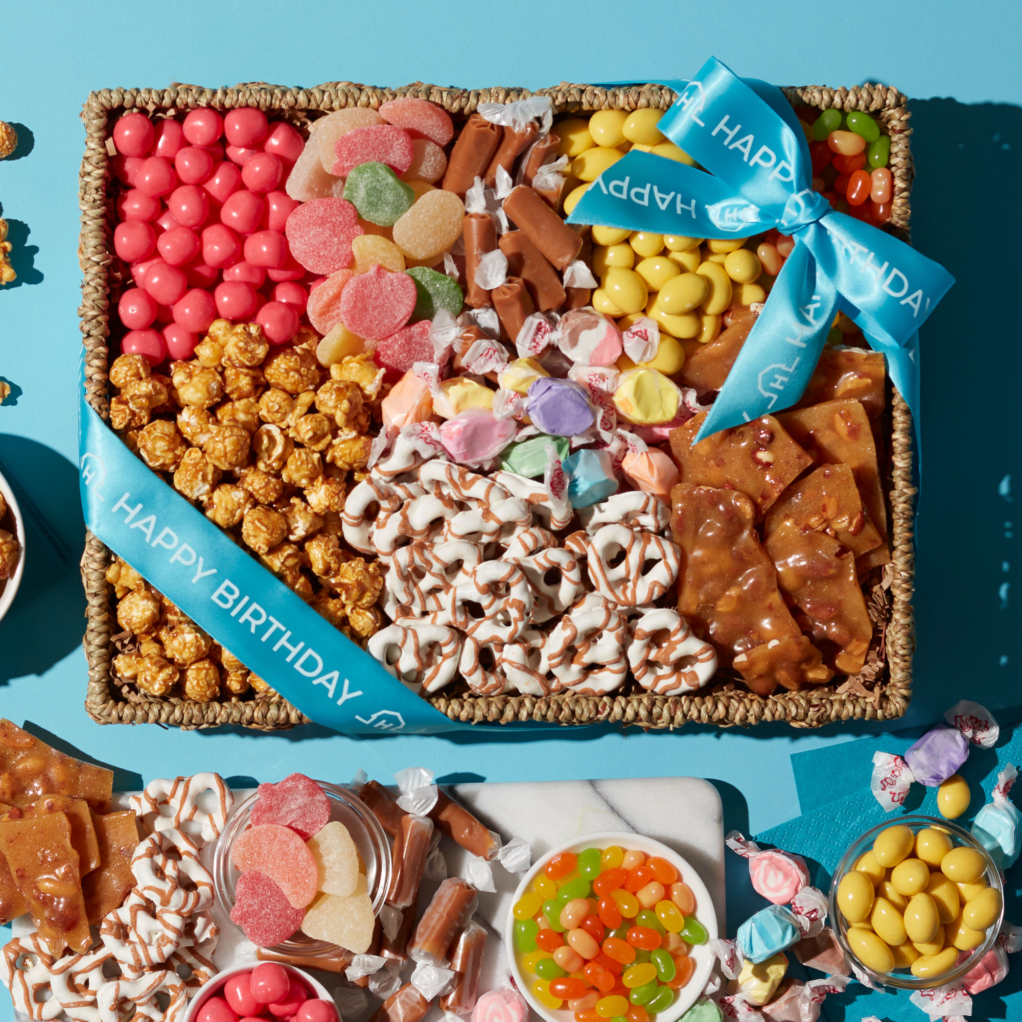 This beautiful basket is filled to the brim with unique snacks to delight a special someone's sweet tooth.