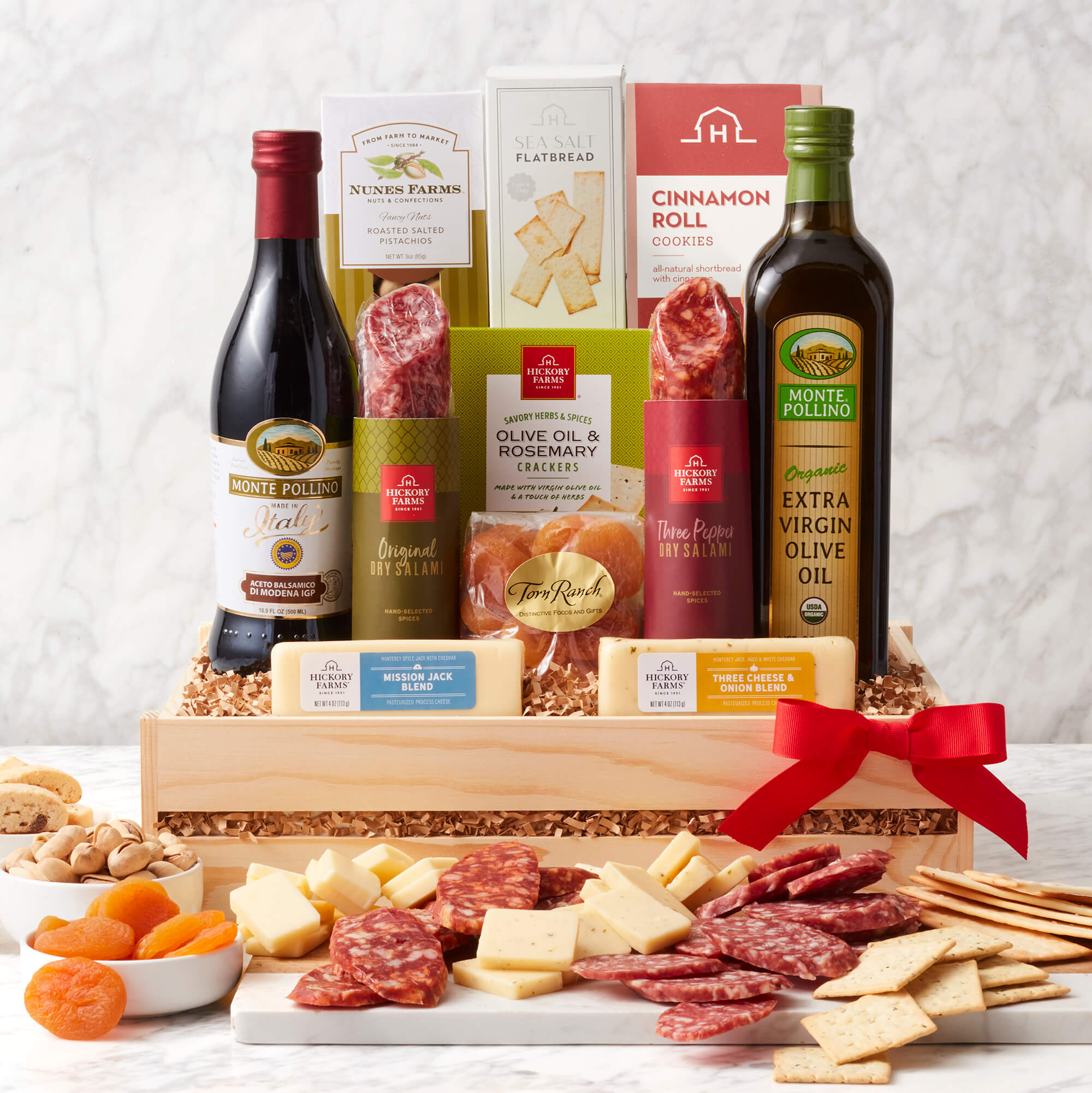 Italian Charcuterie Gift Crate includes salami, various cheeses, crackers, olive oil, and nuts