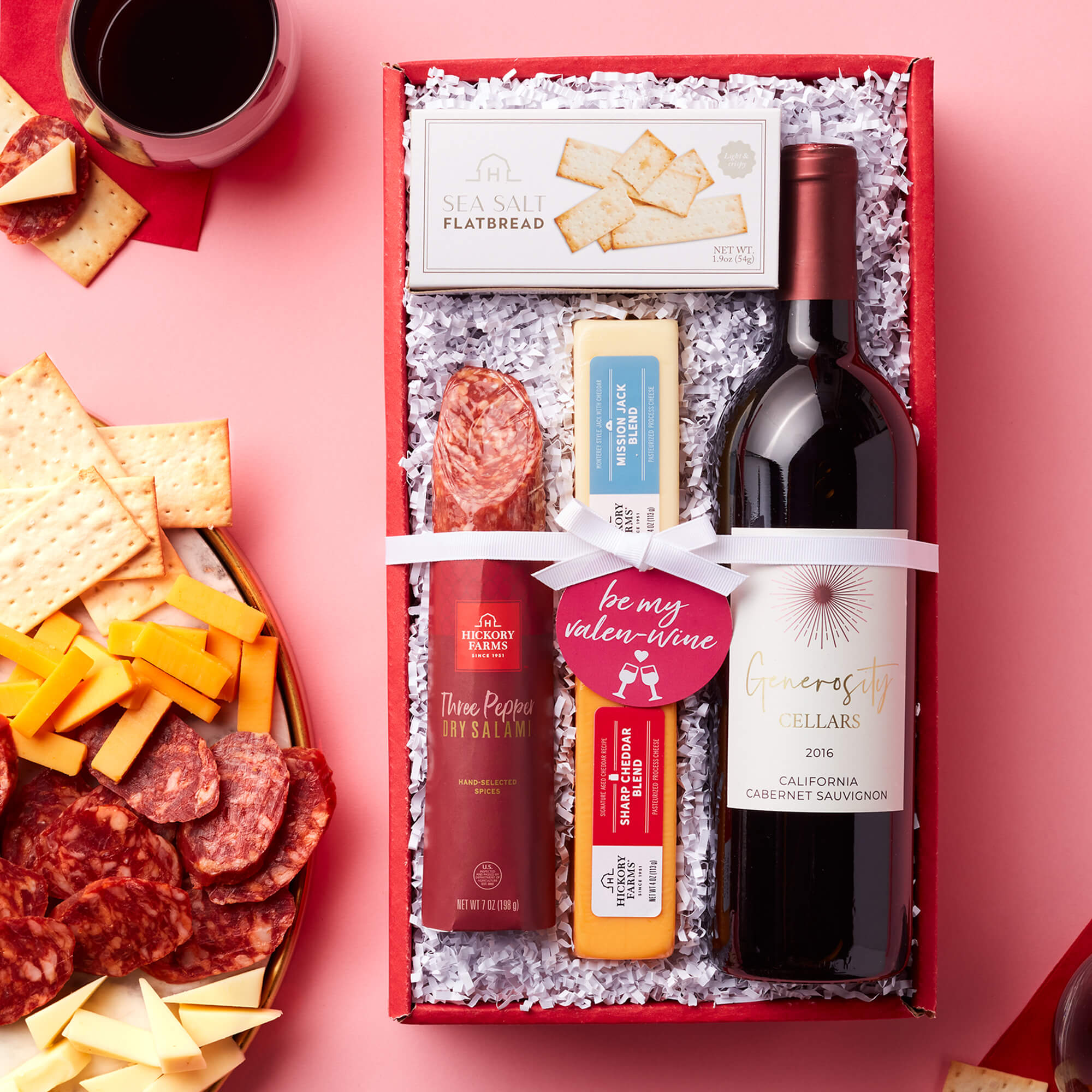 Valentine's Day Cabernet & Snack Collection includes red wine, salami, cheese, and flatbread