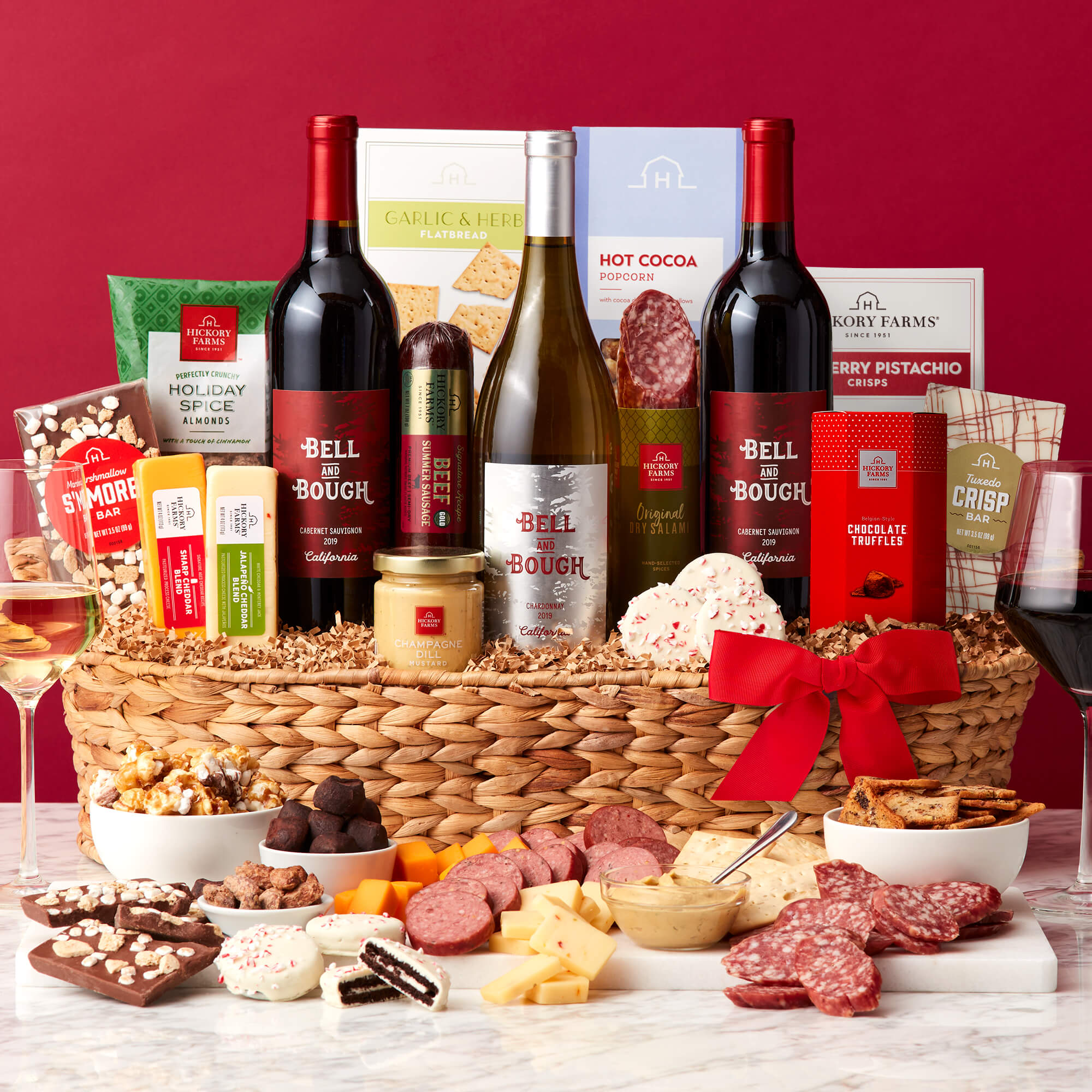 Grand Holiday Wine Gift Basket includes beef sausage, salami, cheese, mustard, crackers, almonds, and wine