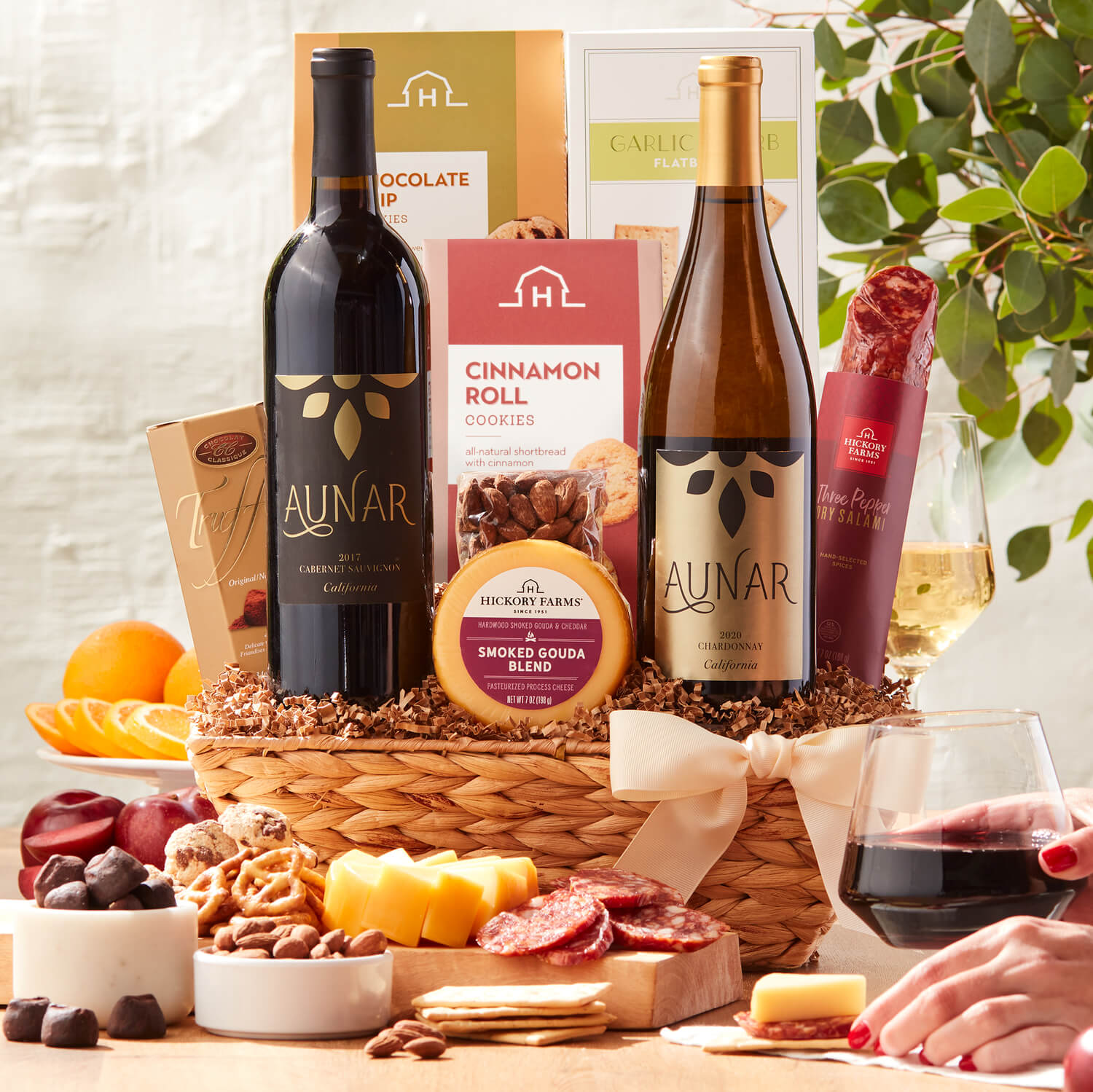 California Getaway Wine Gift Basket includes dry salami, various cheeses, crackers, chocolates, and wine
