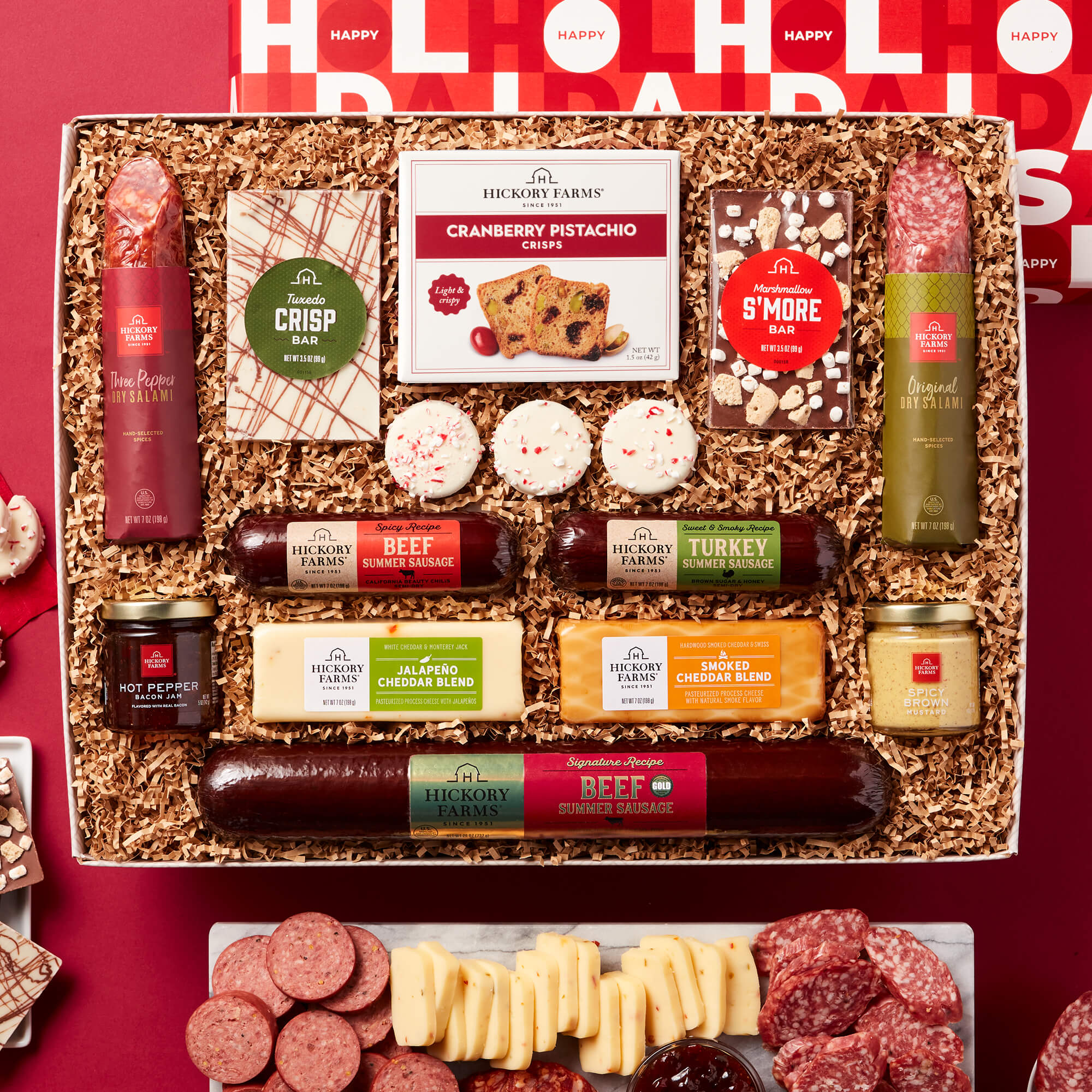 Grand Holiday Gift Box includes beef sausage, turkey sausage, salami, various cheeses jam, mustard, crackers, and nuts