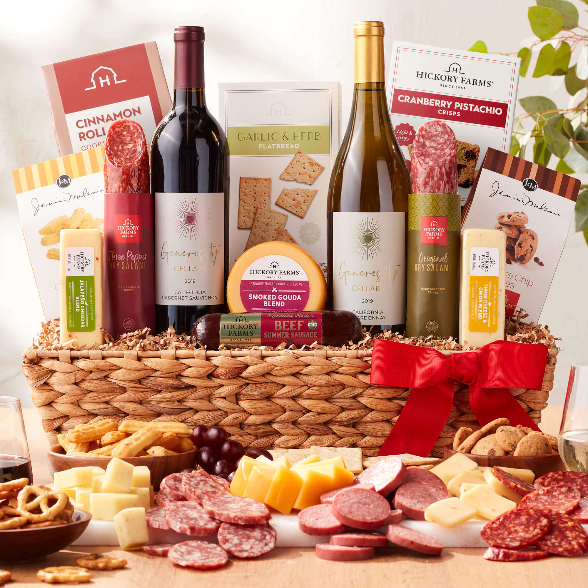 Deluxe Sip & Snack Wine Gift Basket includes beef sausage, dry salami, various cheeses, crackers, cookies, & wine